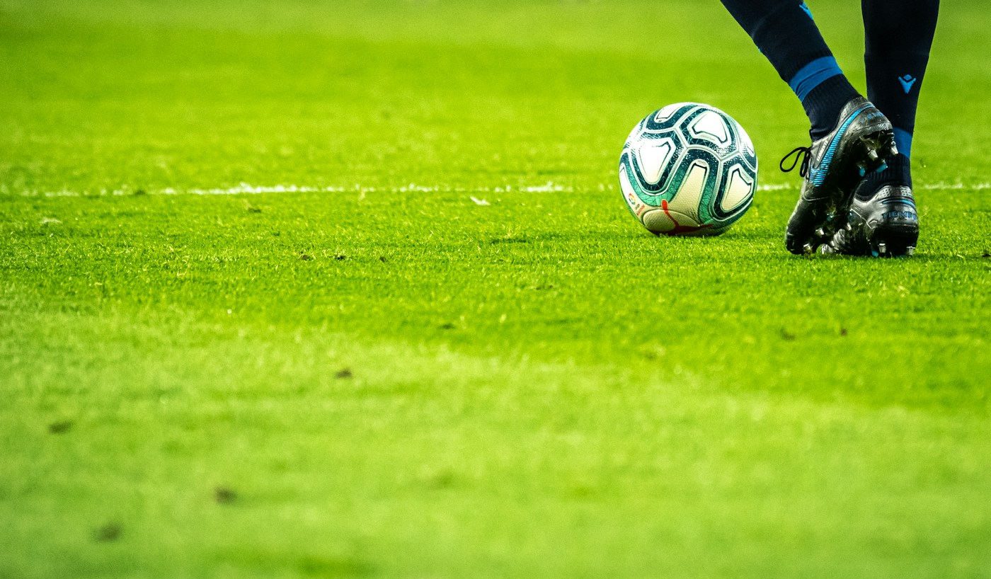 Football match on a green pitch
